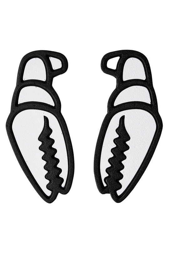 A pair of black and white claw-shaped stomp pads on a plain white background.
