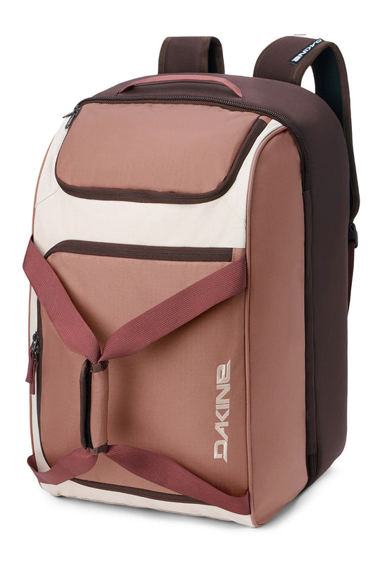 A Dakine backpack in a color-blocked design of dusty rose, cream, and dark brown, shown from a three-quarter angle on a white background.