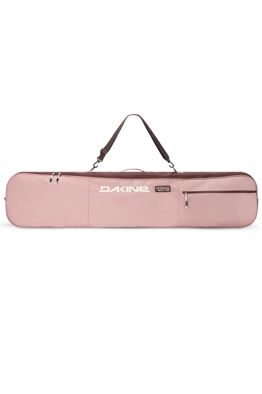 A pink Dakine instrument gig bag with a dark brown shoulder strap and silver zippers, shown against a plain white background.