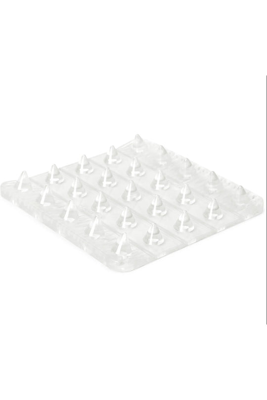 A clear plastic board with multiple small raised pegs or hooks, shown on a plain white background.