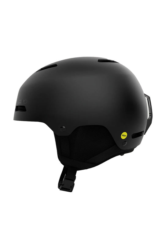 A matte black ski helmet with a small yellow sticker on the side, shown from a three-quarters angle against a plain white background.