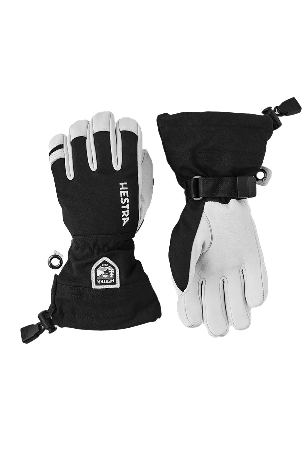 Black and white gloves with Hestra logo on a white background