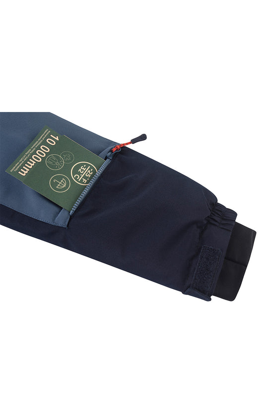 Close-up of a dark navy sleeve or cuff with a green hangtag reading 40 000m, shown on a plain white background.