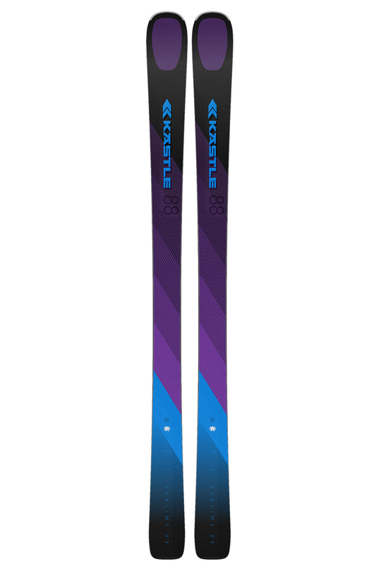 A pair of Kastle skis shown vertically side-by-side against a plain white background. The skis feature a color-blocked design with purple and blue geometric patterns on a black base.