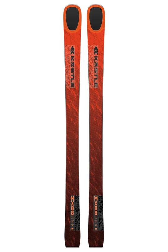 A pair of Kastle skis in a vibrant orange and red gradient design with black accents, shown vertically against a plain white background.