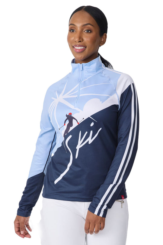 Woman wearing a blue and navy long-sleeve top with a graphic design on a white background