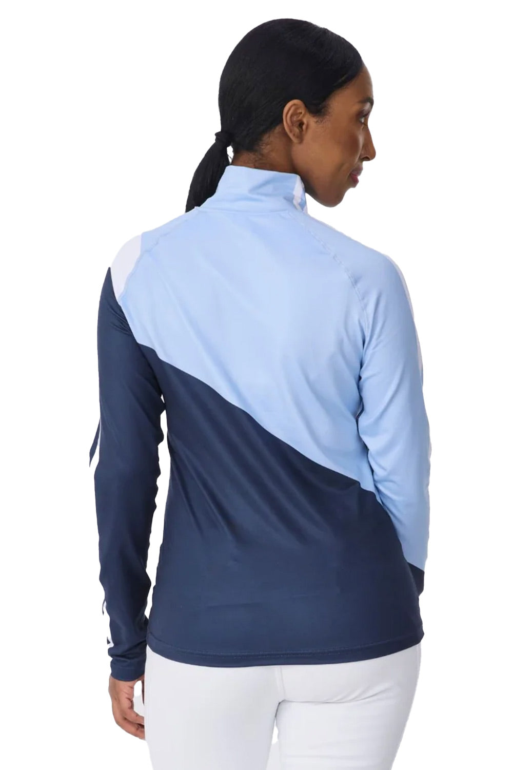 A woman shown from the back wearing a long-sleeve athletic quarter-zip jacket with a colorblock design in light blue and navy, paired with white pants, against a plain white background.