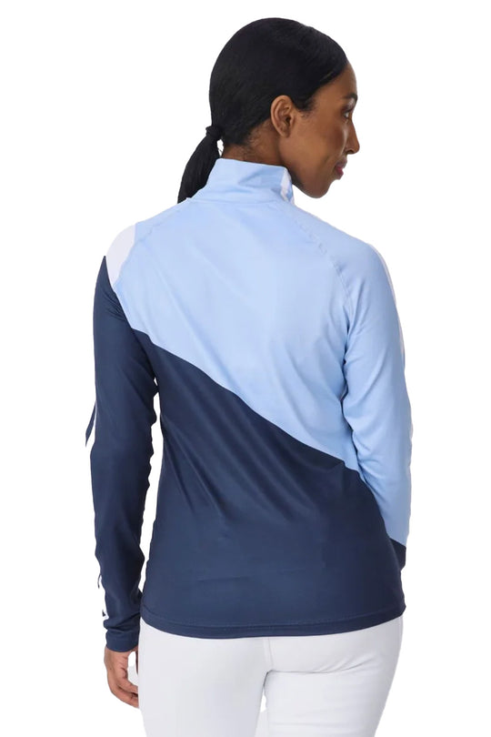 A woman shown from the back wearing a long-sleeve athletic quarter-zip jacket with a colorblock design in light blue and navy, paired with white pants, against a plain white background.