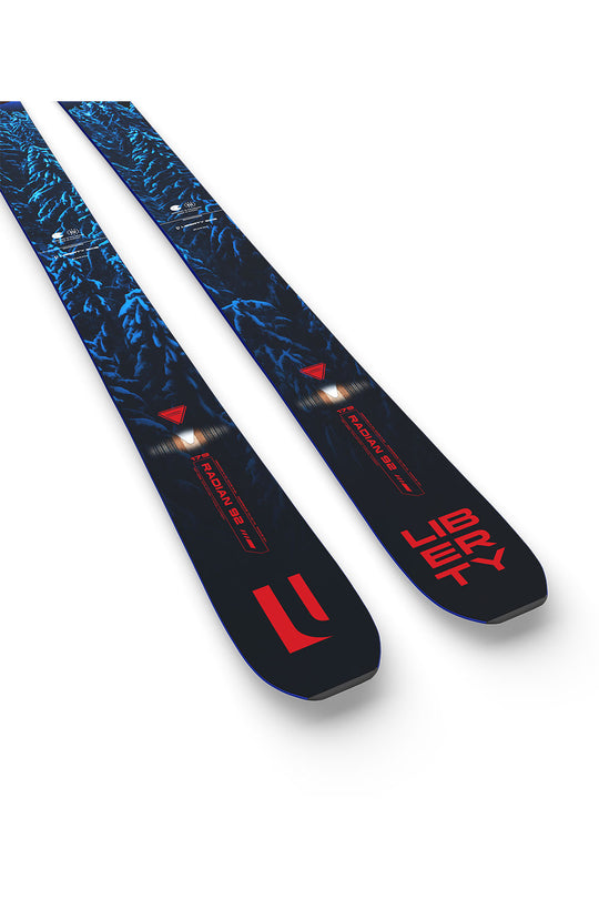 Two blue and black skis with red branding on a white background