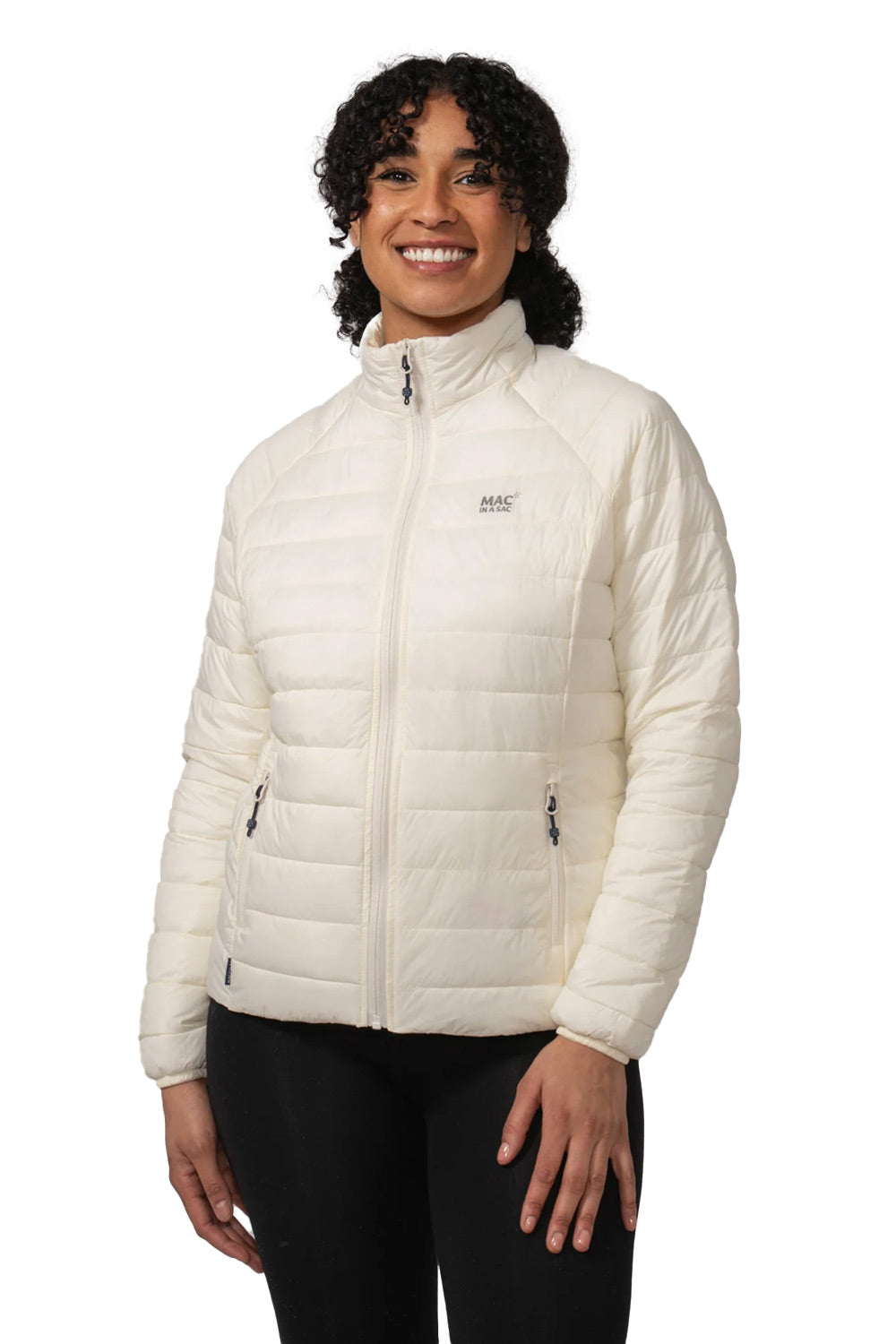 A woman wearing a white quilted puffer jacket with a high collar and black pants, standing against a plain white background.