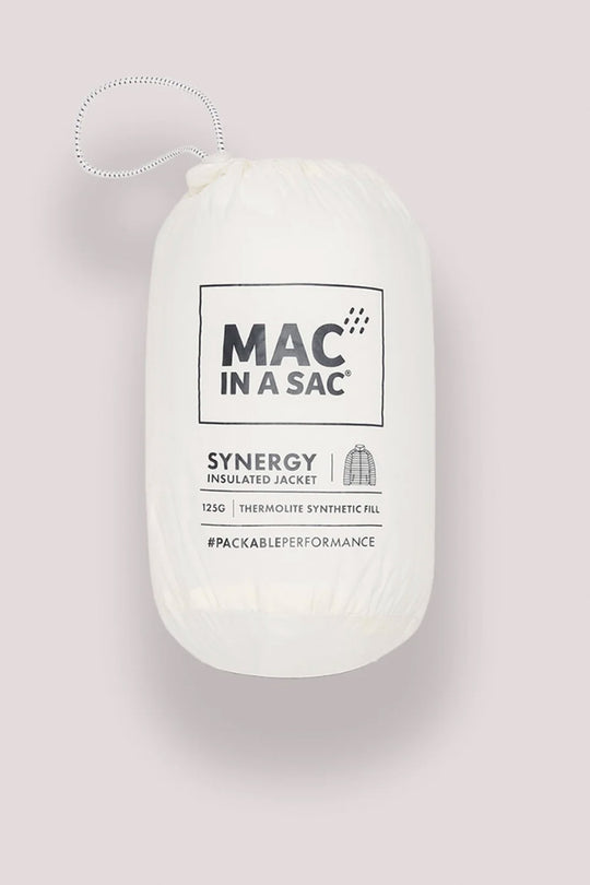 A white Mac in a Sac Synergy insulated jacket packable synthetic fill pouch, shown against a solid pale pink background.