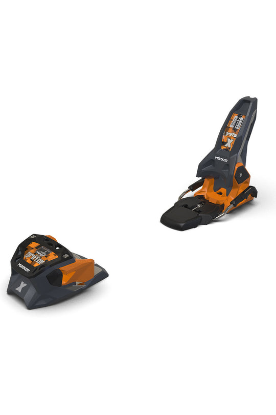 Pair of black and orange ski bindings on a white background