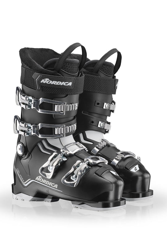Pair of black Nordica ski boots on a white background