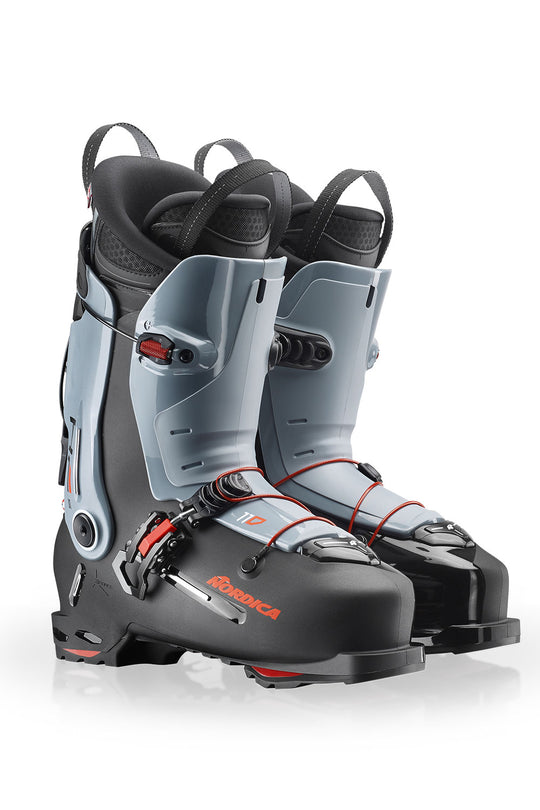 Pair of gray and black ski boots with visible branding on a white background