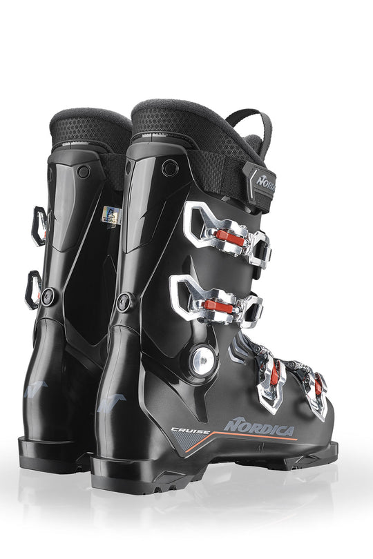 Black ski boots with visible brand logo on a white background