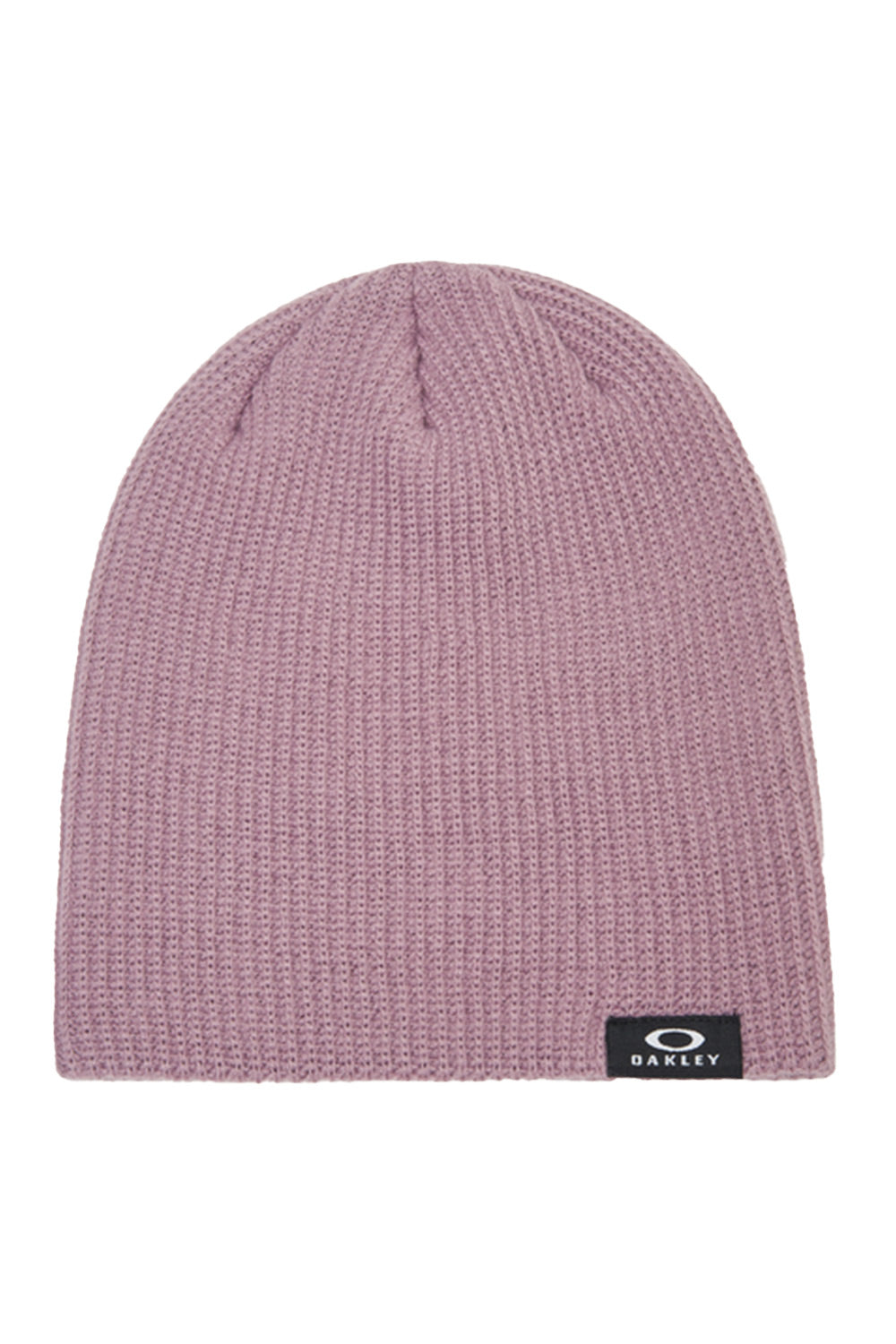 A dusty pink ribbed knit beanie hat with a small black Oakley logo patch on the lower right edge, shown against a plain white background.