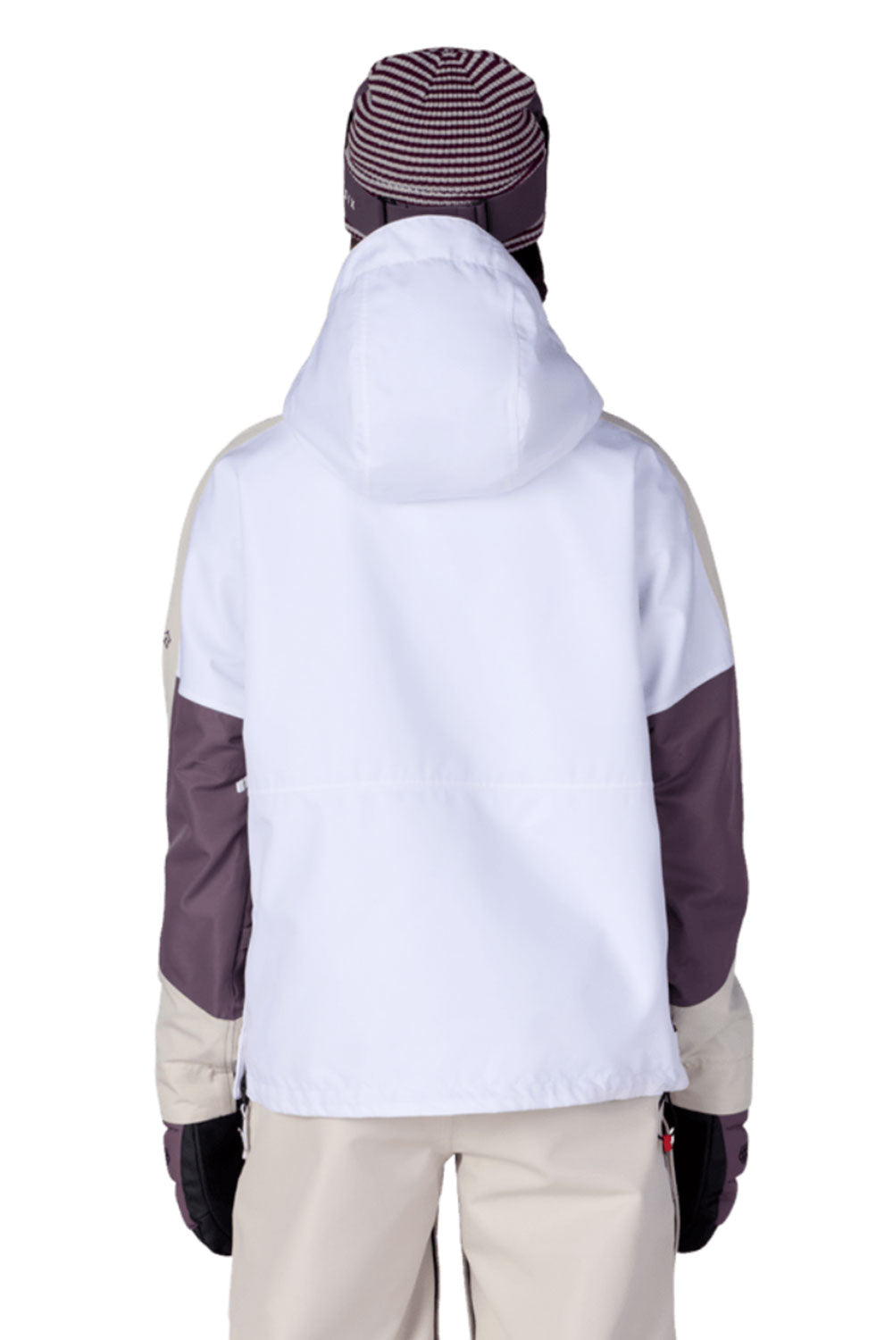 Person wearing a white snow jacket with purple accents on a white background