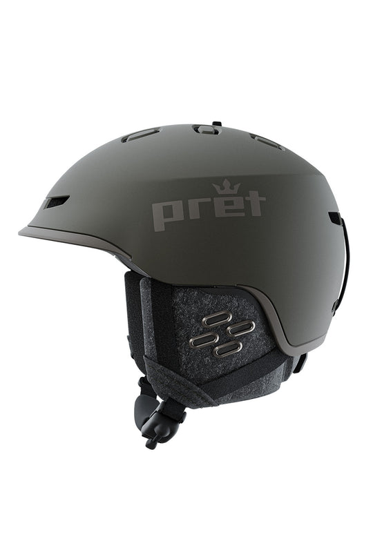 A matte dark gray Pret snow helmet with a matching dark gray chin strap and interior padding, shown from a side profile on a solid white background.