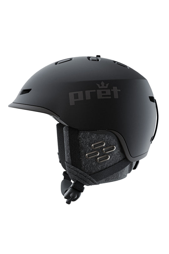 A matte black ski helmet with the Pret brand name and crown logo printed in gray on the side, shown from a profile view against a solid white background.