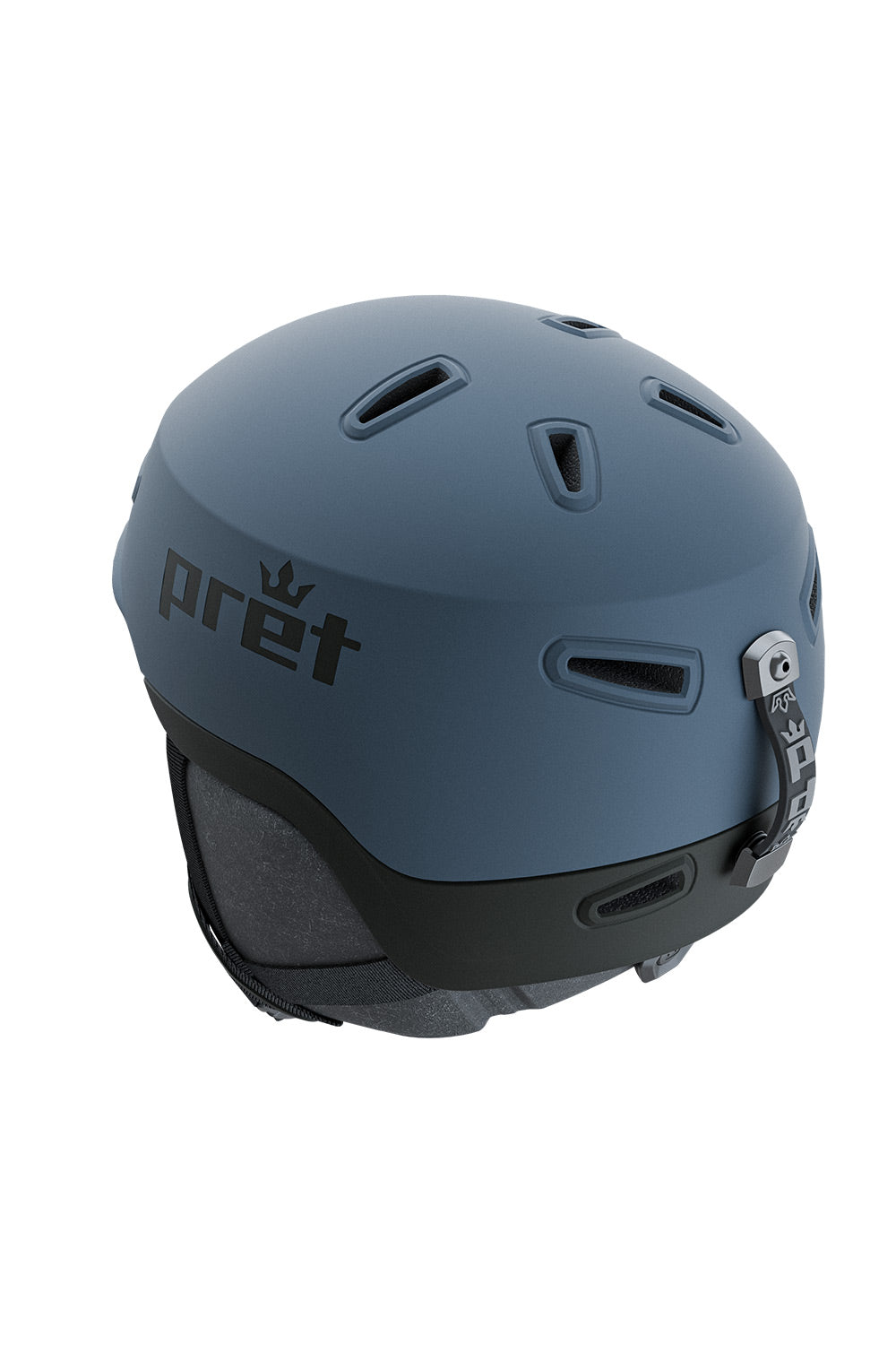 A matte slate blue ski helmet with a black chin strap and the Pret brand logo printed on the side, shown against a plain white background.