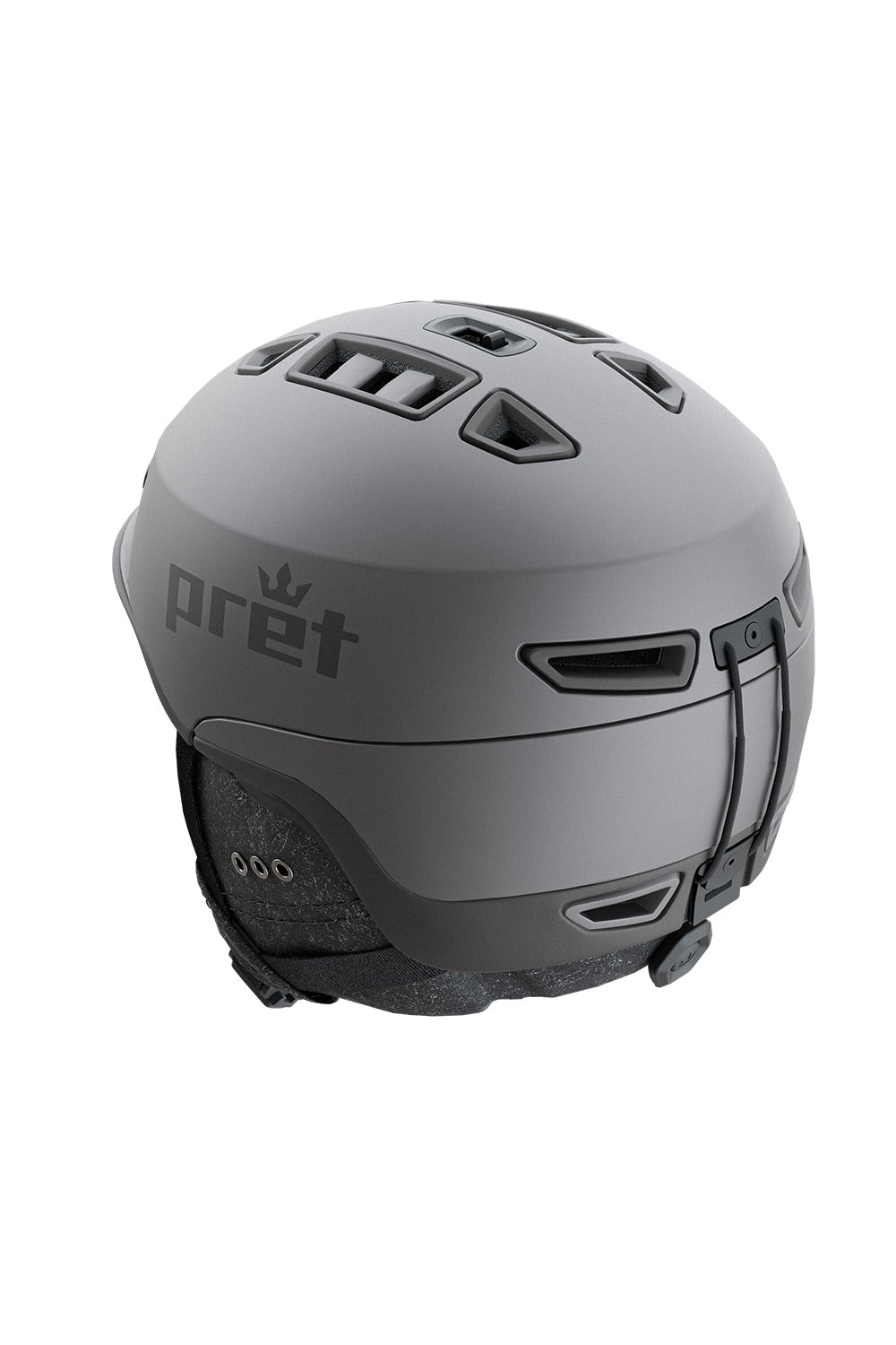 A matte dark gray ski helmet with the Pret brand logo printed on the side, shown from a three-quarters rear angle against a plain white background.