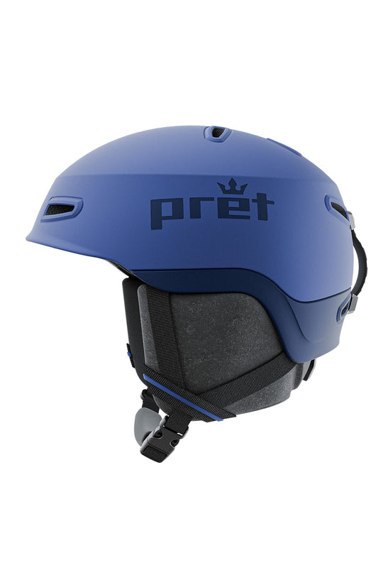 A matte blue ski helmet with the brand name 'pret' and a small crown logo printed in black on the side, shown in profile against a solid white background.
