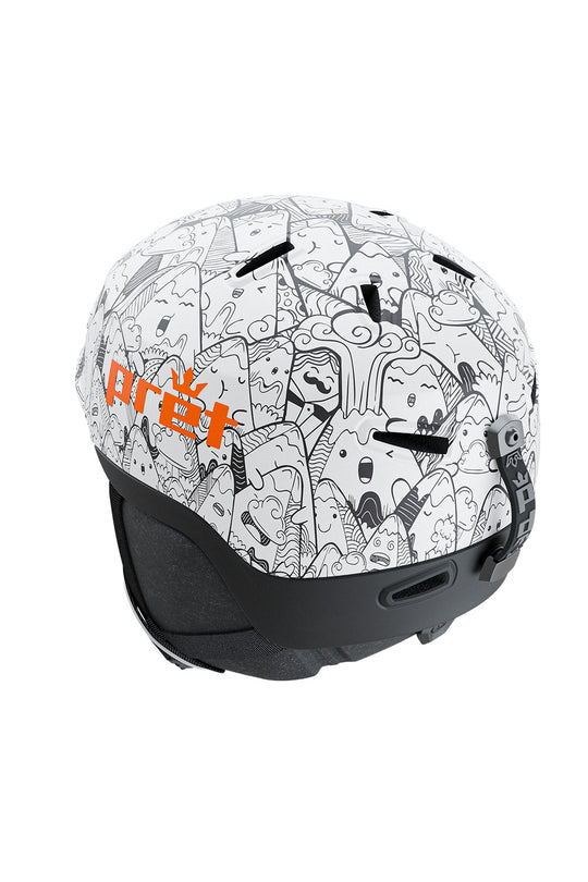 A ski helmet featuring a white base covered in black cartoon-style doodles, with a prominent orange 'PRET' logo on the side and a solid black chin guard.