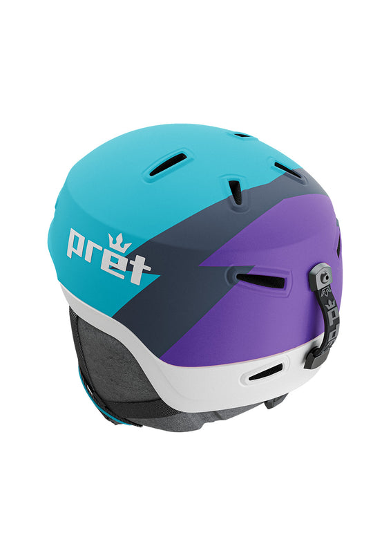 A color-blocked ski helmet by Pret, featuring a bright cyan upper section, a dark navy diagonal stripe, a purple lower section, and a white front bumper, shown on a plain white background.