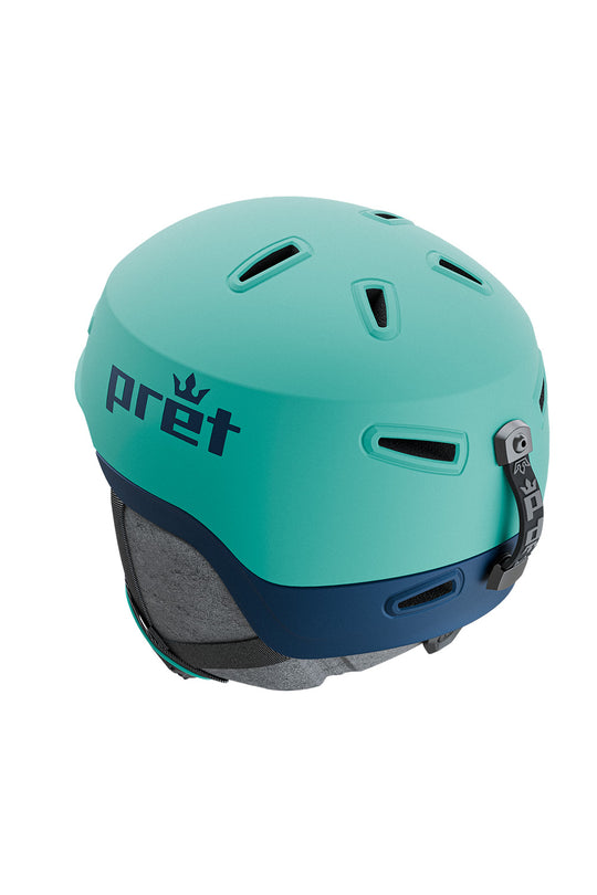 A mint green and navy blue ski helmet with the brand name 'pret' printed in navy on the side, shown against a plain white background.