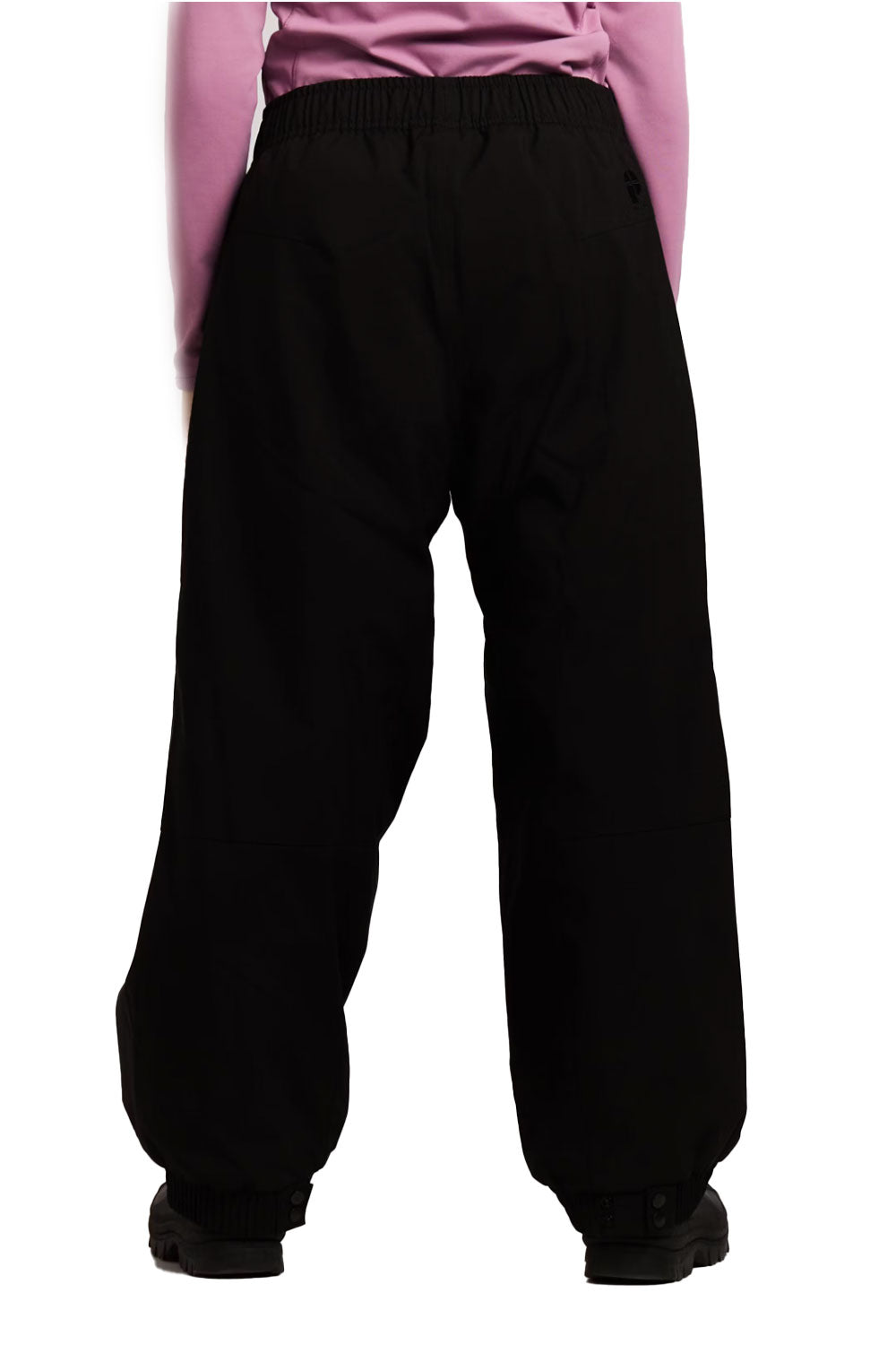 Black pants worn by a person on a white background
