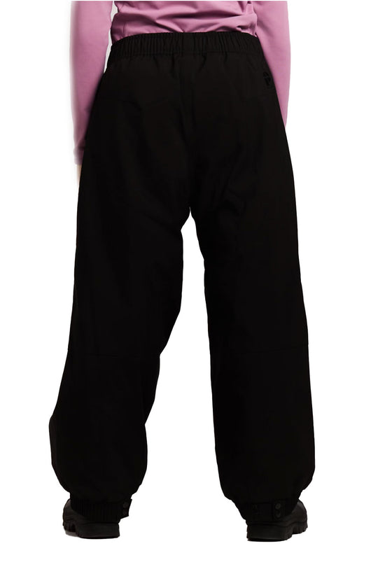 Black pants worn by a person on a white background