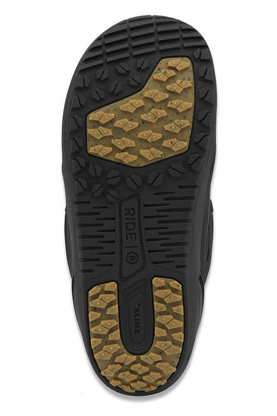 Close-up of a snowboard boot sole with tread pattern and brand logo on a white background