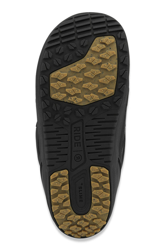 Close-up of a snowboard boot sole with tread pattern and brand name on a white background