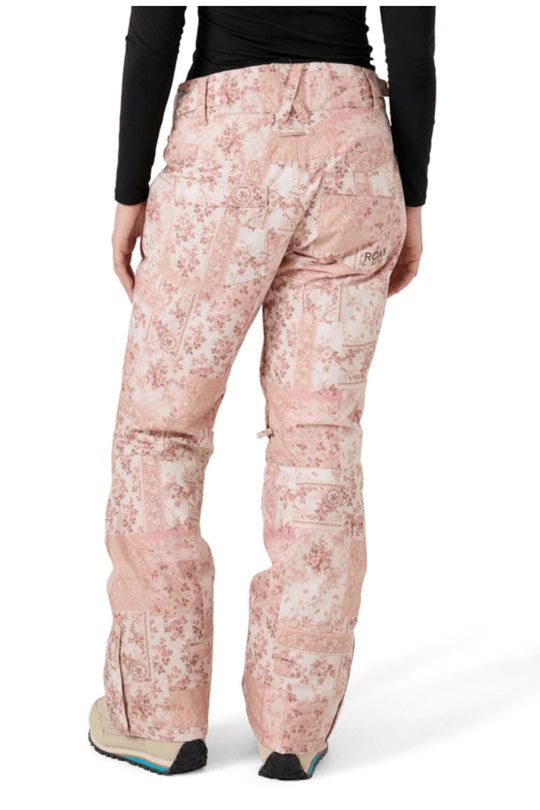 Pink floral-patterned pants worn by a person on a white background