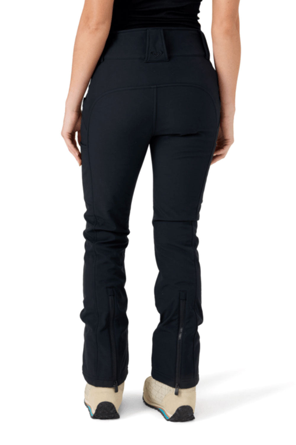 Black pants worn by a person on a white background