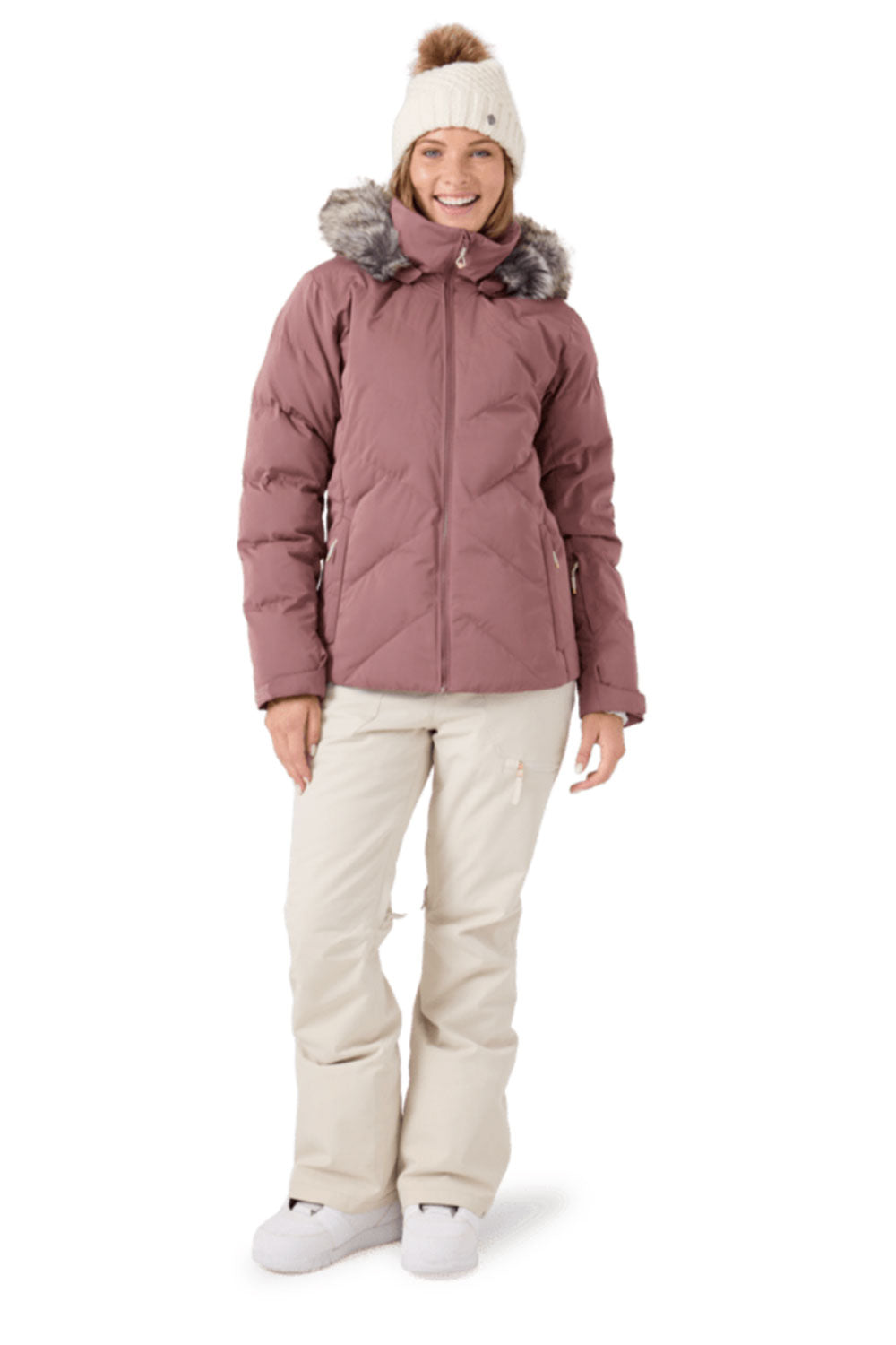 Person wearing a pink winter coat with fur trim on a white background