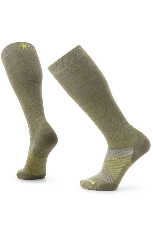 Pair of green knee-high socks on a white background