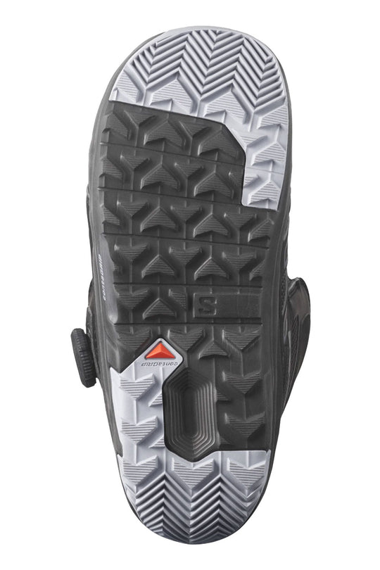 Close-up of a snowboard boot sole with tread pattern and brand logo on a white background
