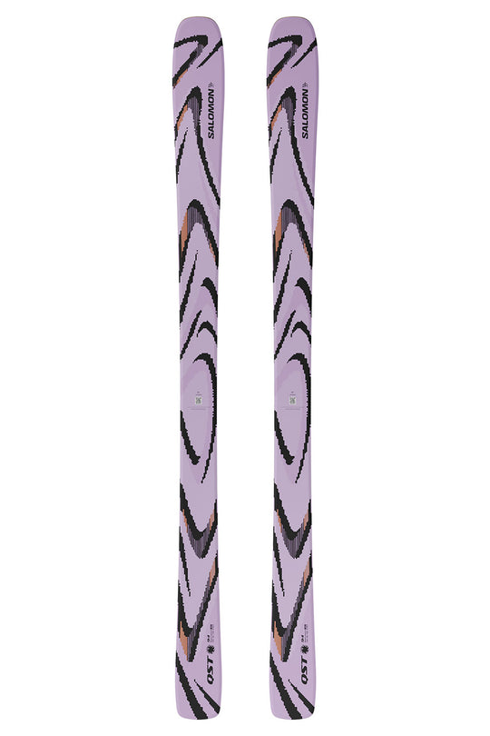 Pair of purple skis with black and orange patterns on a white background