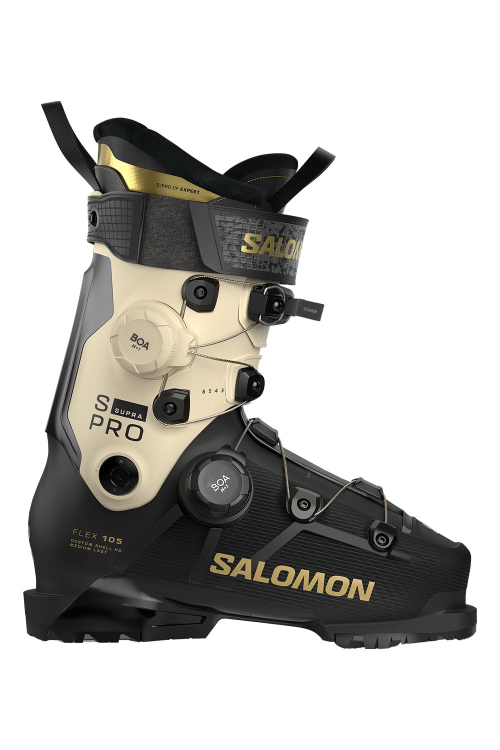 Salomon S Pro ski boot in black and beige with gold accents, featuring a dial closure system and adjustable buckles, shown against a plain white background.