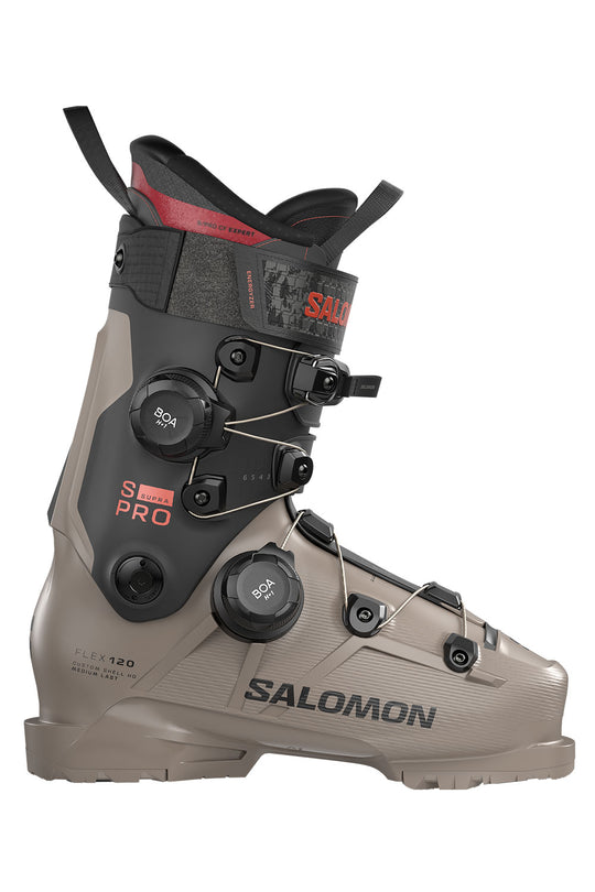Salomon ski boot in a taupe-gray and black colorway with red accents, featuring dual BOA dials and the Salomon S/Pro Pro line branding.