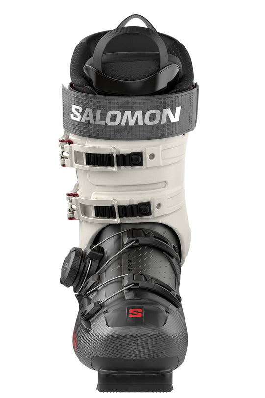 Salomon ski boot in white and black with gray strap, shown from the front on a white background.