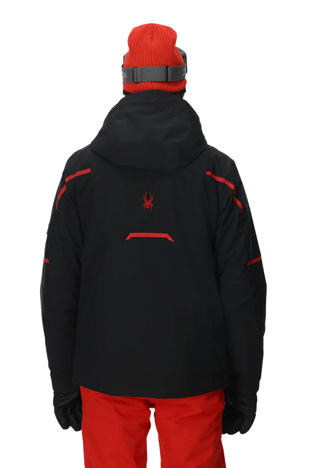 Person wearing a black jacket with red accents and a red beanie on a white background