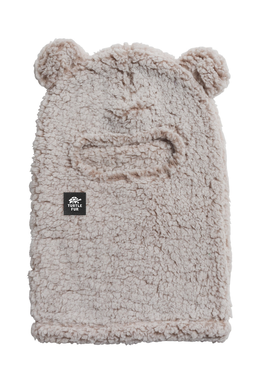A light beige sherpa fleece beanie hat with bear ears on top and a small black 'TURTLE FUR' brand patch on the front, shown against a plain white background.