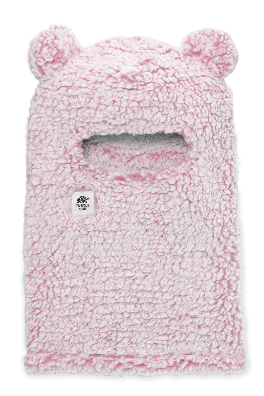 A pink sherpa fleece balaclava mask with bear ears and a central face opening, featuring a small white logo patch on the left side.