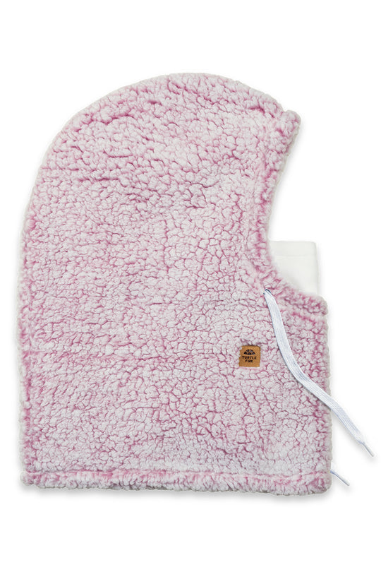 A light pink and white sherpa fleece hooded balaclava with a small tan brand patch and white drawstrings, shown on a plain white background.