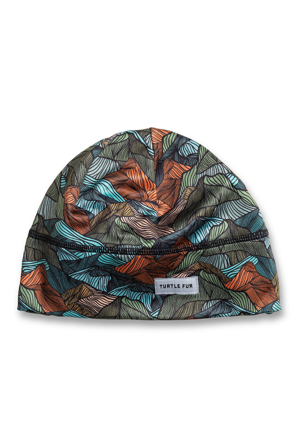 A beanie hat with a colorful abstract pattern of teal, orange, and gray shapes on a dark background, featuring a small white 'TURTLE FUR' brand label.