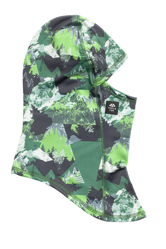 A hooded neck gaiter with a green, black, and white digital camouflage pattern, featuring a small black brand patch on the side.