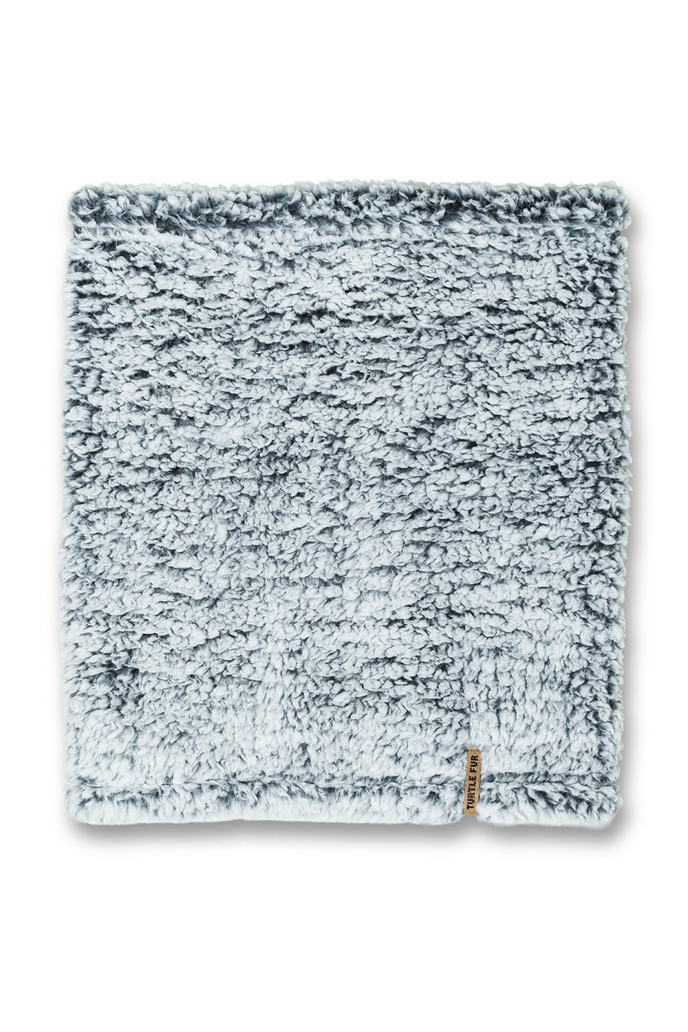 A square, plush, sherpa-textured fleece neck tube in a light blue-gray color, shown flat against a white background with a small brown fabric tag on the bottom right corner.