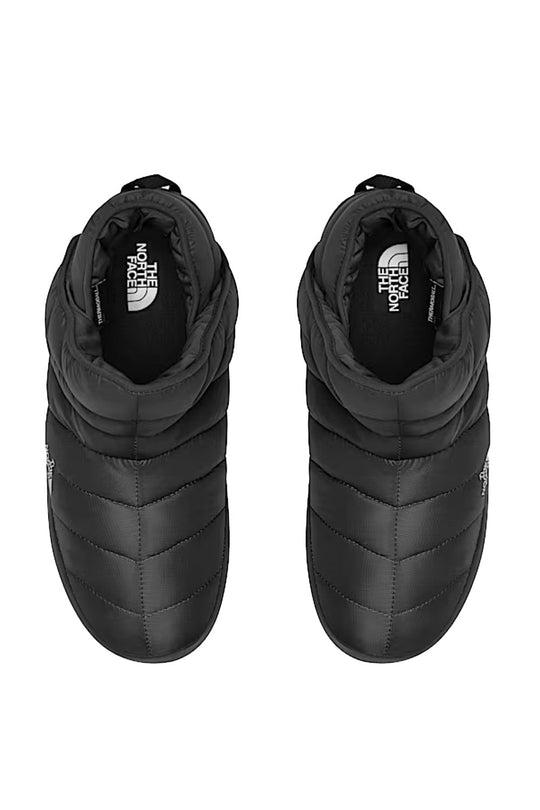 Pair of black high-top sneakers with The North Face logo on a white background